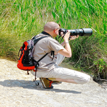 man with camera taking picture