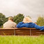 senior couple sitting on bench