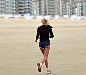 woman running on the beach